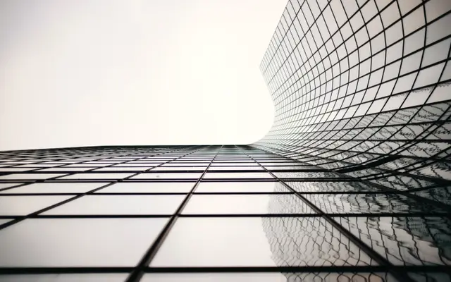 Curved glass grid facade of a modern tower